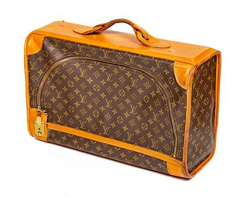 A Louis Vuitton Monogram Canvas Soft Sided Suitcase, 20" L x 12.75" H x 7.5" D; Handle drop: 2.5".