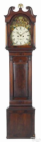 Regency mahogany tall case clock, ca. 1830, with an eight-day movement and a painted face