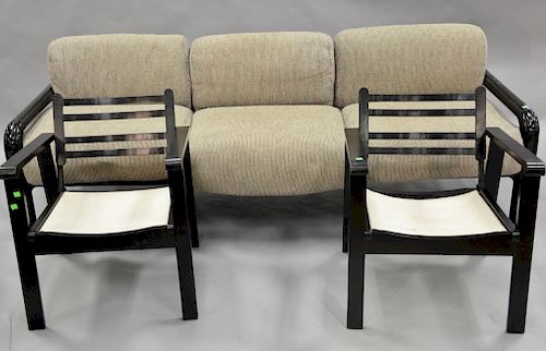 Three piece mid century group to include tube metal sofa along with black painted armchairs. lg. 88 in. There are scratches to the f...