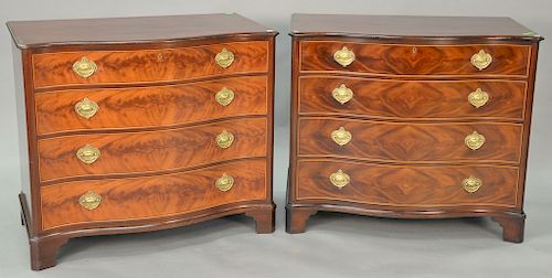 Pair of Schmieg & Kotzian New York reverse serpentine chests. height 34 1/2 in., wd. 38 in.