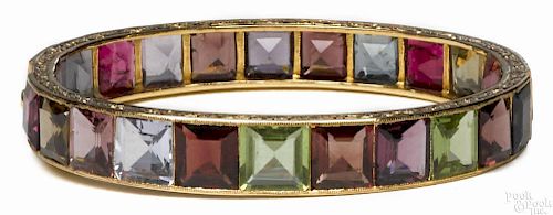 Gem set, 18K yellow gold bangle bracelet with channel-set, square, step-cut gems, 16.2 dwt.