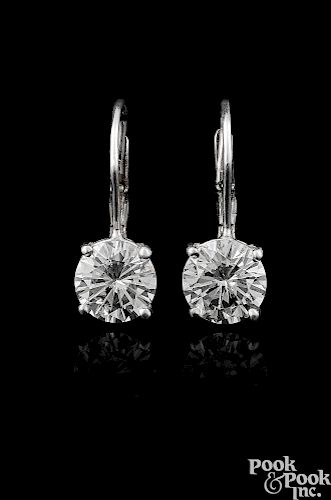 Pair of 14K white gold diamond stud drop earrings