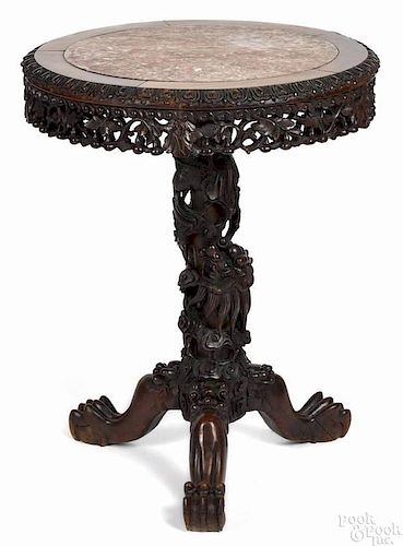 Chinese carved rosewood center table, ca. 1900, with a marble inset top, 31'' h., 24 1/2'' w.