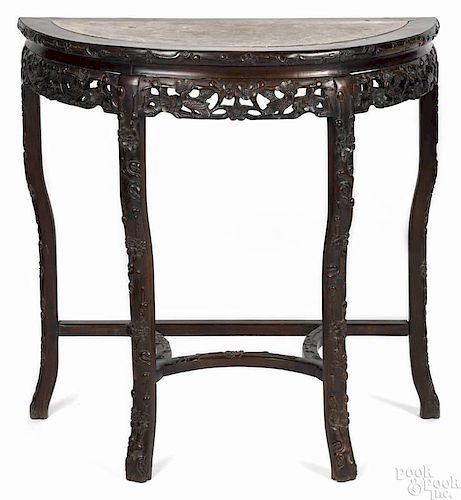Chinese carved rosewood console table, early 20th c., with a marble inset top, 32'' h., 32'' w.