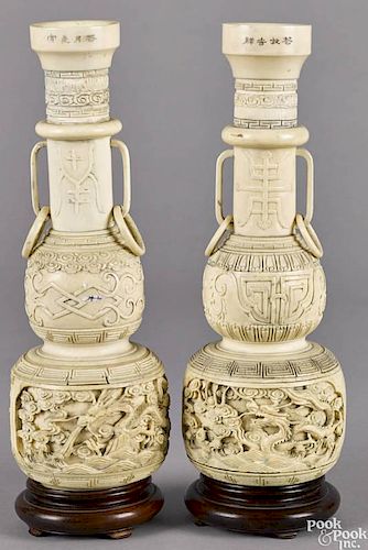 Pair of Chinese carved ivory vases, late 19th c., with dragon decoration, 10 1/2'' h.