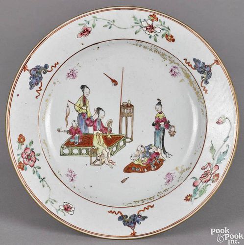 Chinese export porcelain plate, 18th c., with ladies and children engaging in leisurely activities