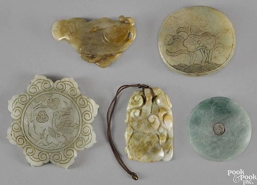 Five Chinese jade pendants, to include a white jade example with an incised crane