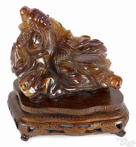 Chinese carved agate figure of a reclining man, 3 1/2'' x 4 3/4''.
