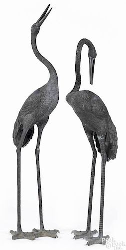 Pair of Oriental bronze cranes, 59'' h. and 69'' h.