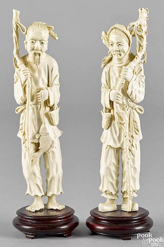 Pair of Japanese carved ivory figures, ca. 1900, of an elderly man and woman, 10'' h.