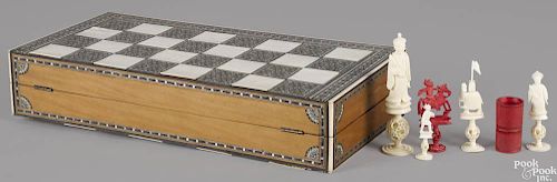 Chinese gameboard, late 19th c., with a carved ivory chess set and a backgammon set