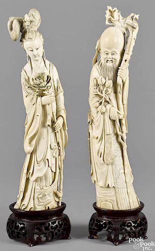 Pair of Chinese carved ivory figures, late 19th c., Longevity and the Flower God, 15 3/4'' h.