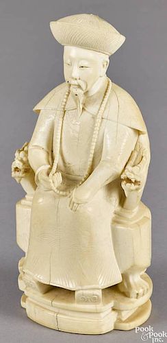 Chinese carved ivory figure of a gentleman, 19th c., seated in a dragon chair, 6'' h.
