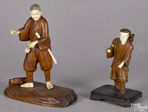 Two Japanese carved boxwood, ivory, and mother of pearl appliquéd figures, Meiji period, 9 1/2'' h.
