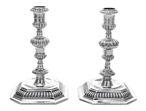 * A Pair of William III Silver Candlesticks, John Laughton, London, 1701, each having a baluster stem gadroon banded knops, rais