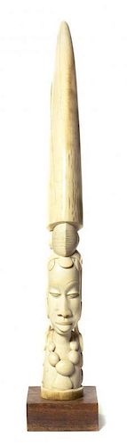 * An African Carved Ivory Tusk, Height of ivory 28 inches.