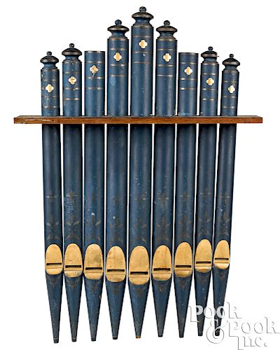 Nine painted wood organ pipes