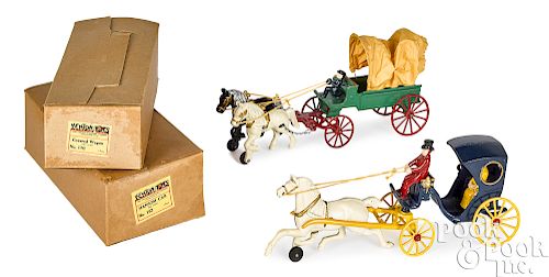 Two Kenton cast iron horse drawn wagons