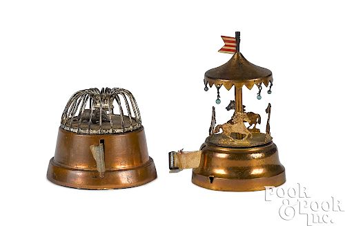Two brass and metal figural tape measures
