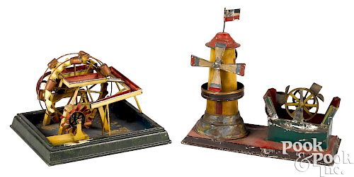 Two painted tin waterwheel steam toy accessories