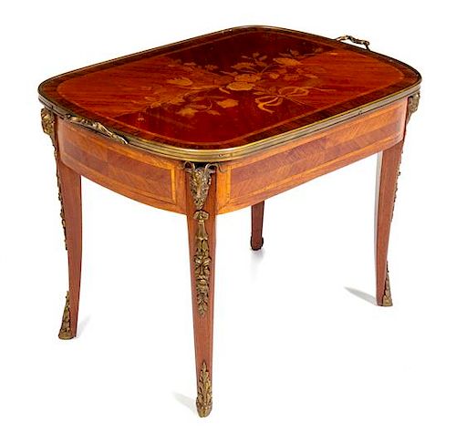 A Louis XV/XVI Transitional Style Gilt Metal Mounted Marquetry Side Table Height 20 3/4 x width 28 1/2 x depth 18 7/8 inches.
