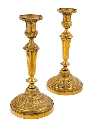 A Pair of Empire Style Brass Candlesticks Height 11 1/4 inches.