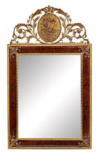 * A Neoclassical Gilt Metal Mounted Mirror Height 53 x width 31 1/2 inches.