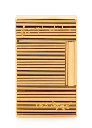 An S.T. Dupont Mozart: Requiem Limited Edition Line 2 Pocket Lighter Height 2 1/2 inches.