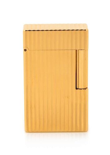 An S.T. Dupont Limited Edition Line 1 Gold-Plated Pocket Lighter Height 2 1/4 inches.
