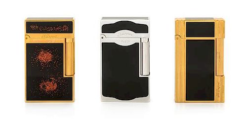 Three S.T. Dupont Line 2 Lacquered Pocket Lighters Height 2 1/2 inches.