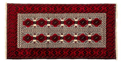 A Bokhara Wool Rug 5 feet 10 1/2 inches x 3 feet 2 1/2 inches.