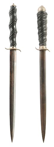 Two Similar Daggers with Carved Wood Grips
