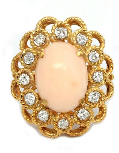 AN 18K GOLD, DIAMOND AND PINK CORAL CABOCHON RING