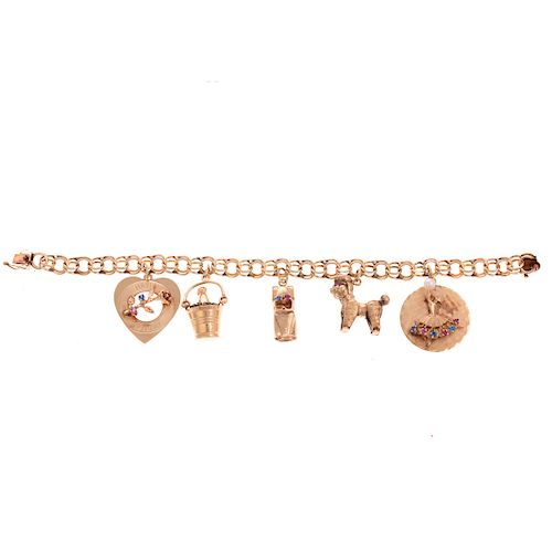 A Ladies 14K Charm Bracelet with 5 Charms
