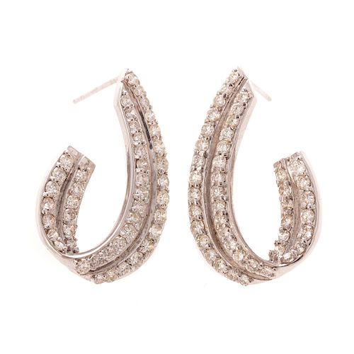 A Ladies Pair of Diamond Earrings in Platinum