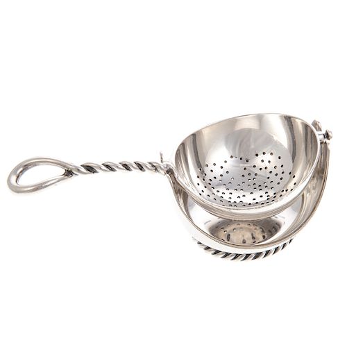 Continental silver tea strainer on stand