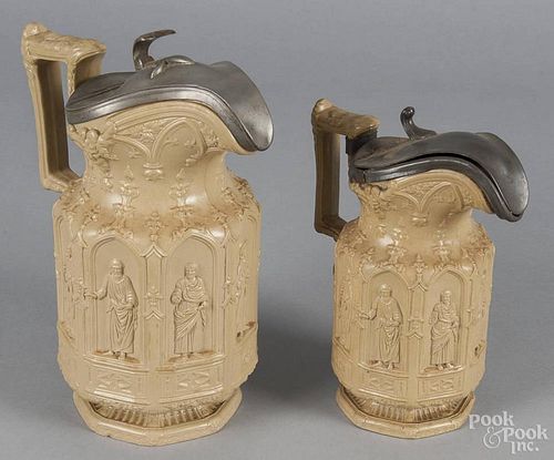 Two English salt glaze apostle pitchers, 19th c., with pewter covers, 9 1/2'' h. and 8'' h.