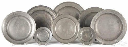 Eight English and Continental pewter plates, 19th c., to include a marital plate, a pair of London b
