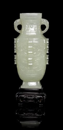 * An Archaistic Carved Jade Vase Height of jade 3 1/8 inches.