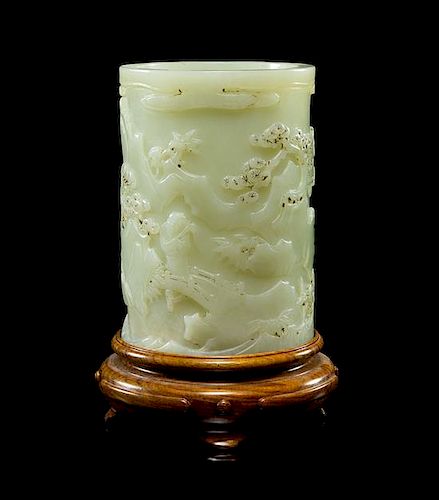 A Carved White Jade Brushpot Height 4 1/2 inches.