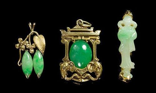 A Group of Three Jadeite Pendants Height of tallest 1 1/2 inches.
