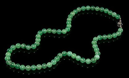 A Jadeite Beaded Necklace. Length overall 16 1/4 inches.