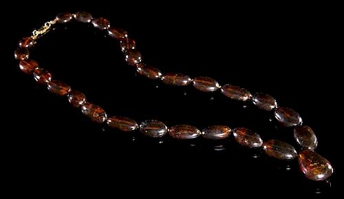 An Amber Beaded Necklace Length overall 14 1/4 inches.