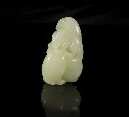 A Carved Jade Toggle of a Badger Height 2 1/2 inches.