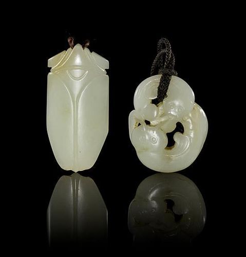* Two Carved Jade Toggles Height of tallest 2 3/4 inches.