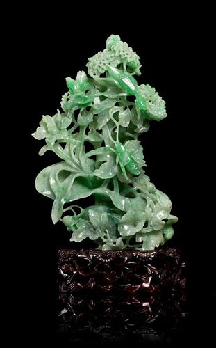 A Jadeite Carving Height 7 inches (with stand).
