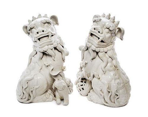A Pair of Blanc-de-Chine Models of Fu Lions Height of first 15 inches.