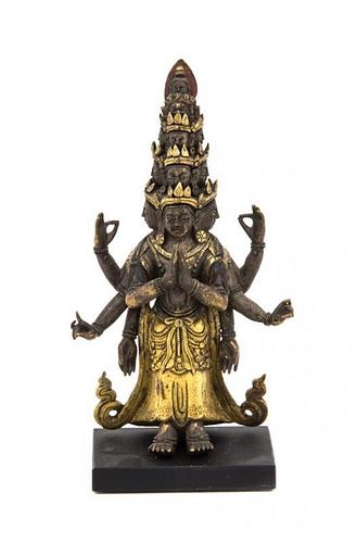 A Gilt Bronze Figure of an Eleven-Headed Avalokitesvara Height 6 inches (without base).