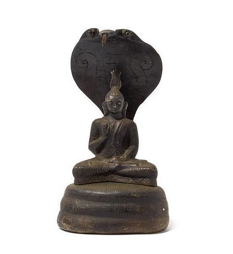 * A Sri Lankan Bronze Figure of a Seated Buddha Height 12 1/4 inches.