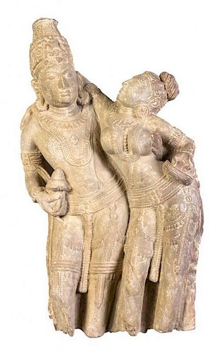 A Carved Sandstone Figural Group of Shiva and Parvati, Rajasthan Height 32 1/2 inches.